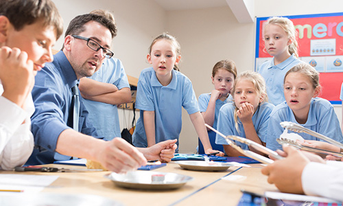 Student and teacher in school lab