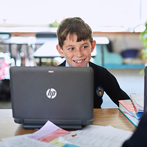 School boy using HP device