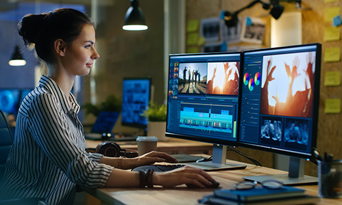 Graphic deisgner using software on dual monitors