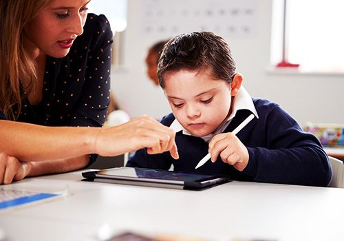 Child with special educational needs using iPad