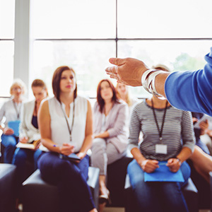 Teachers sat listening in training