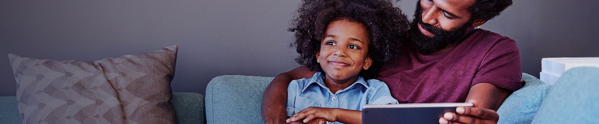 Father and son enjoying TechPerk devices