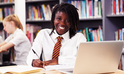 Girl using device in library