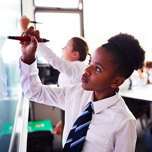 Pupils drawing on interactive board