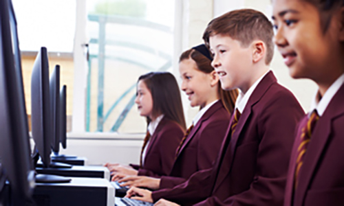 High school children using IT equipment