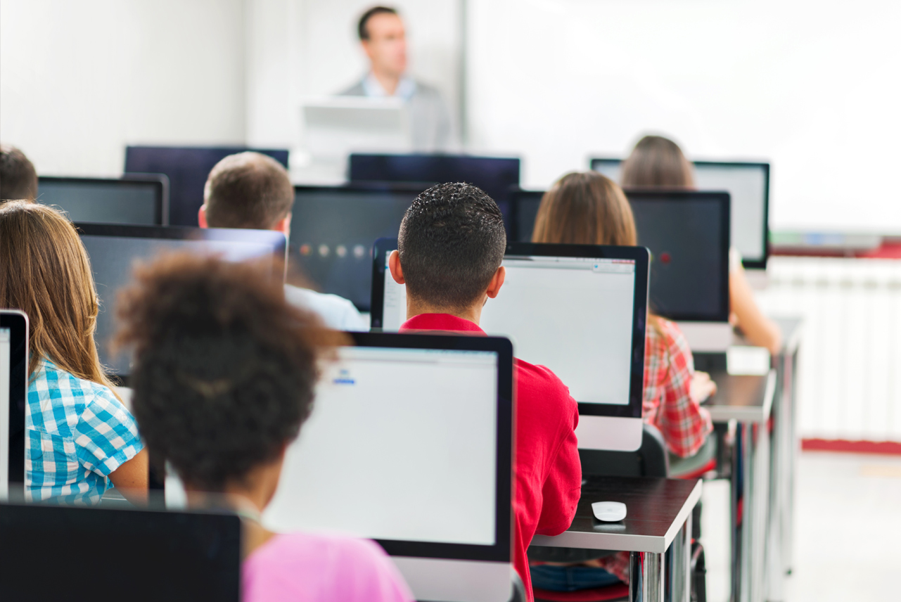 Teacher with students in a lesson