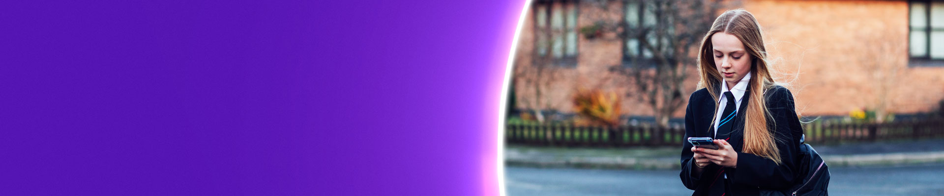 School girl on smartphone alone