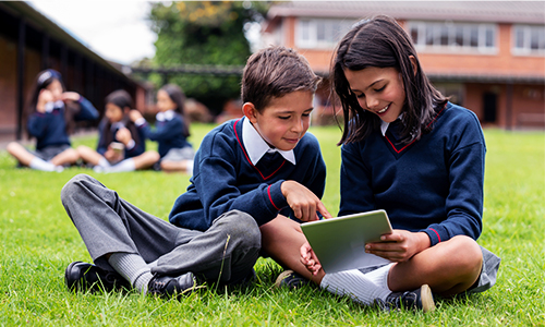 pupils on ipad in field