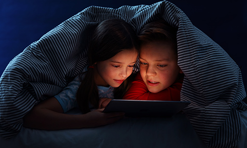 children at home sharing electronic tablet