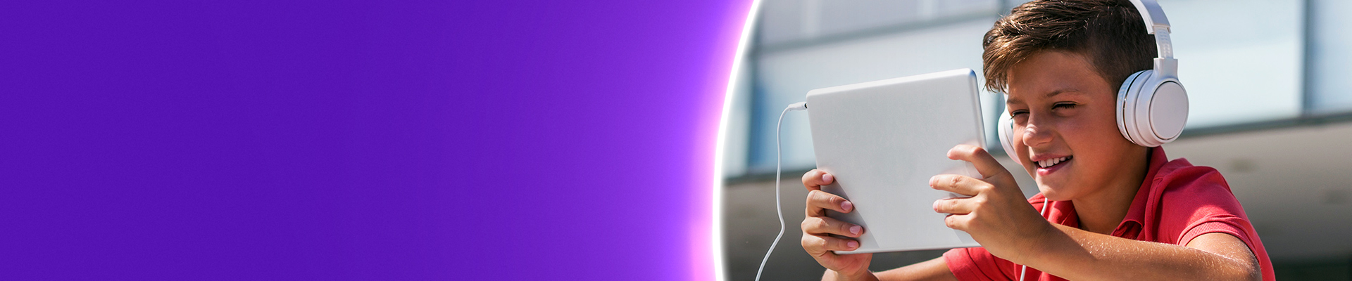 School pupil using mobile device in outer school grounds