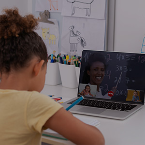 Female student using apple device in classroom