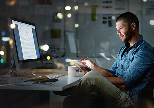 Two girls working on iPad