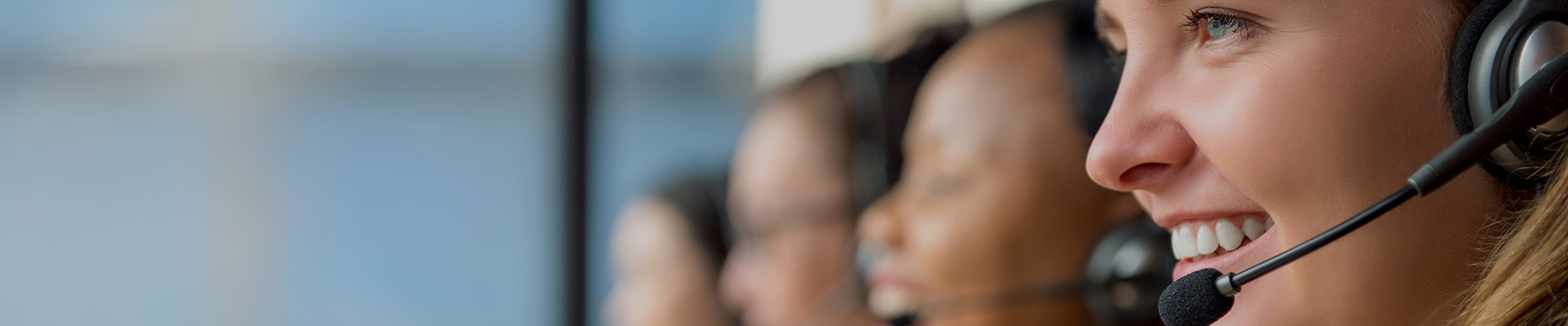 Female IT specialist using headset offering free advice to customers